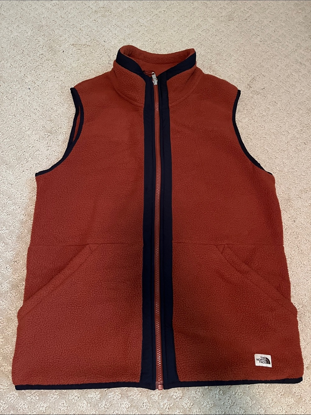 The North Face: Men's Burnt Orange Fleece Vest with Contrast Trim